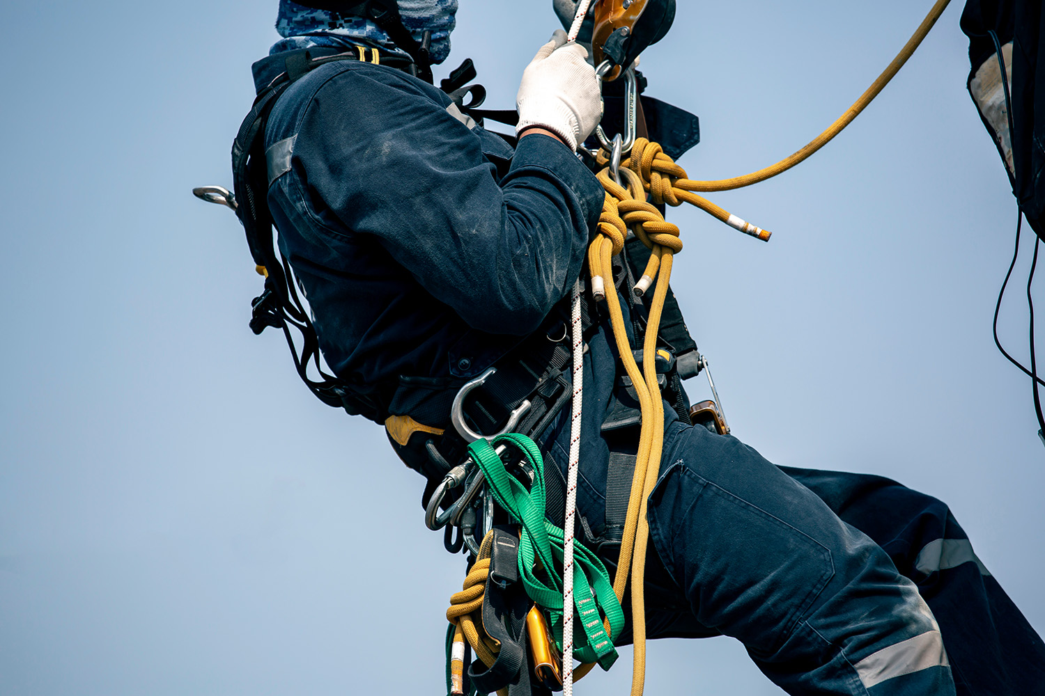 Focus,Male,Worker,Working,At,Height,Wearing,Harness,,Helmet,Safety